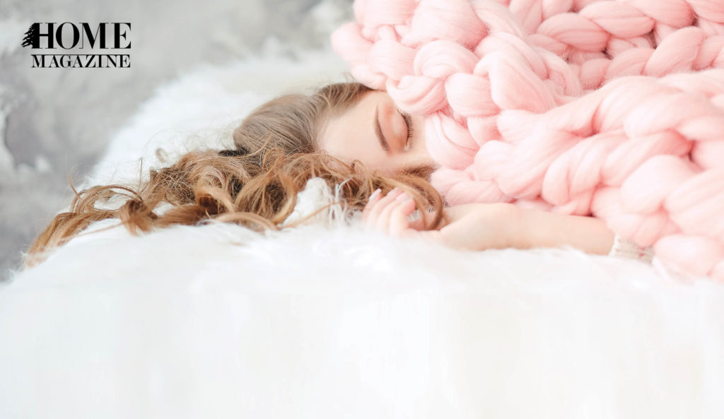Girl sleeping with pink covers