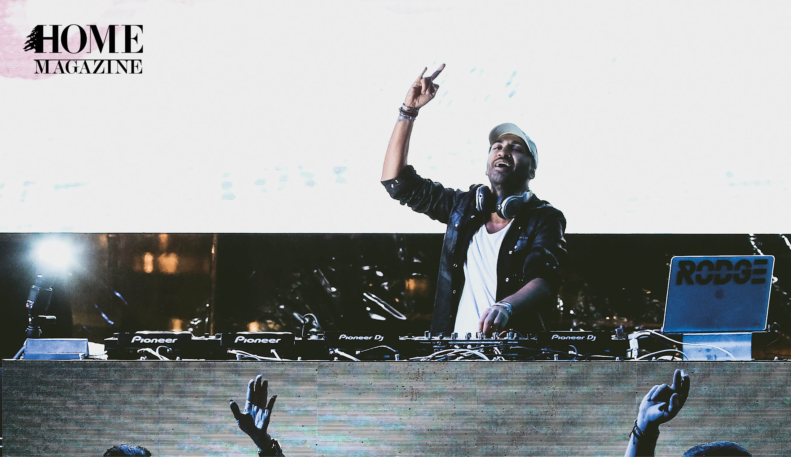 Male DJ with hand in air
