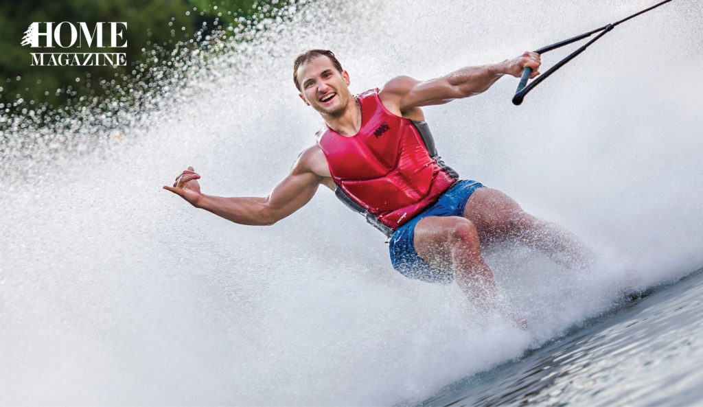 Man in red gilet water surfing