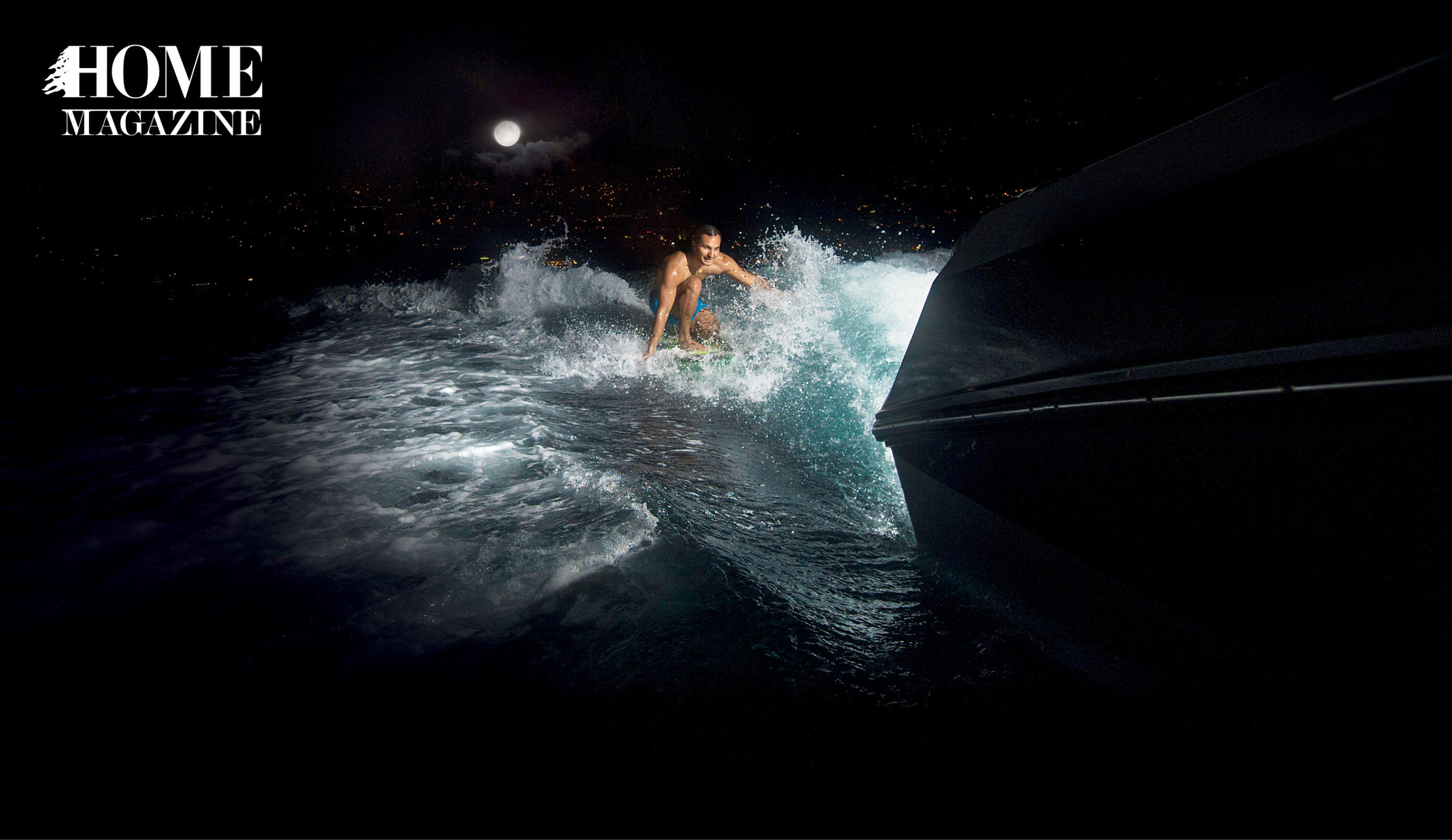Man water surfing at night