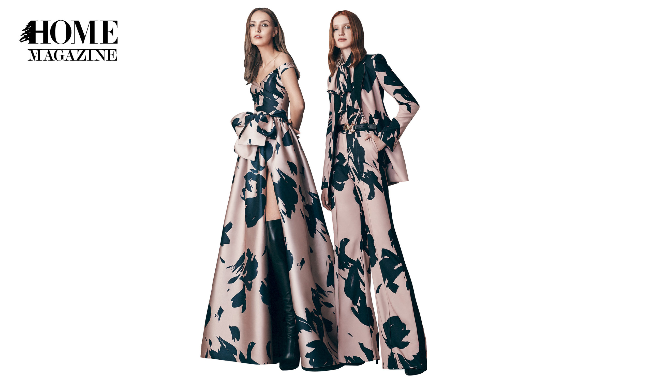 Two models wearing flower printed black and bronze dresses