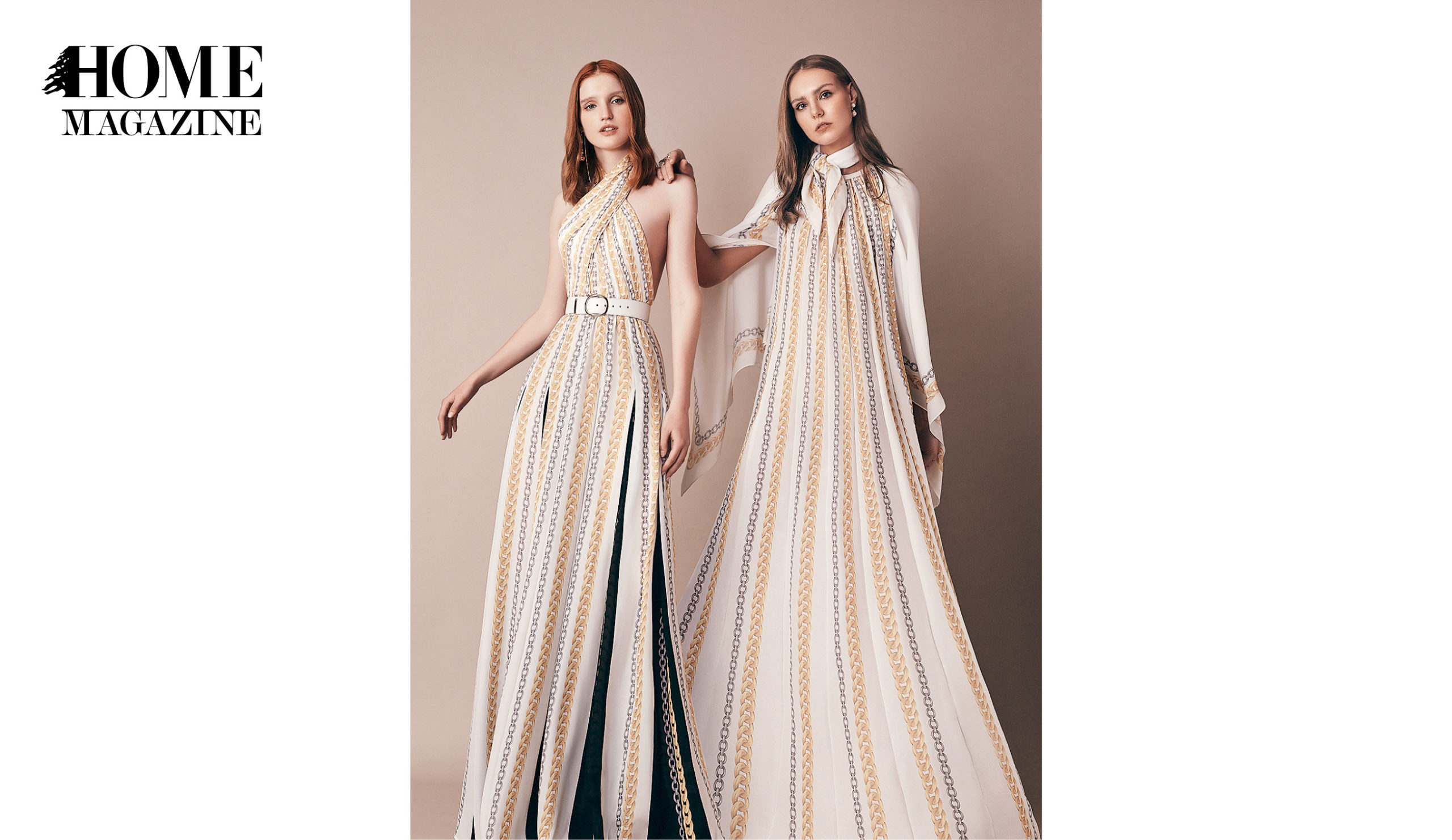 Two models wearing white striped dresses
