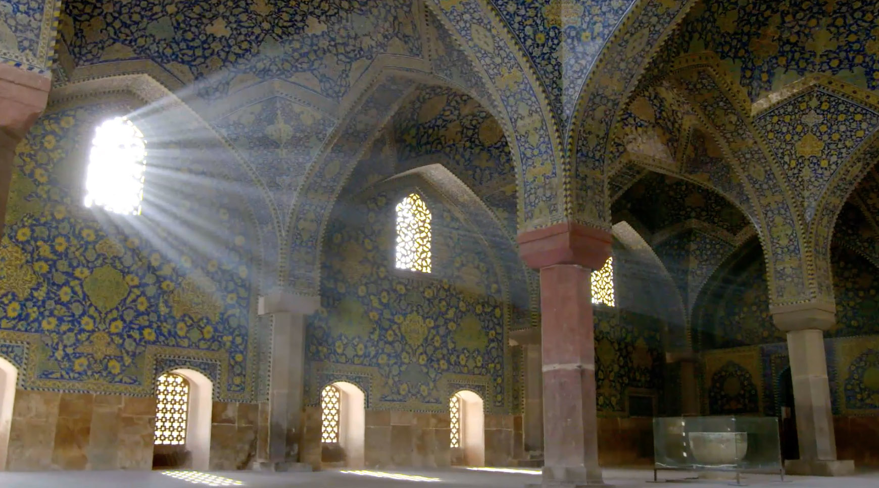 a mosque with light coming in from the windows 