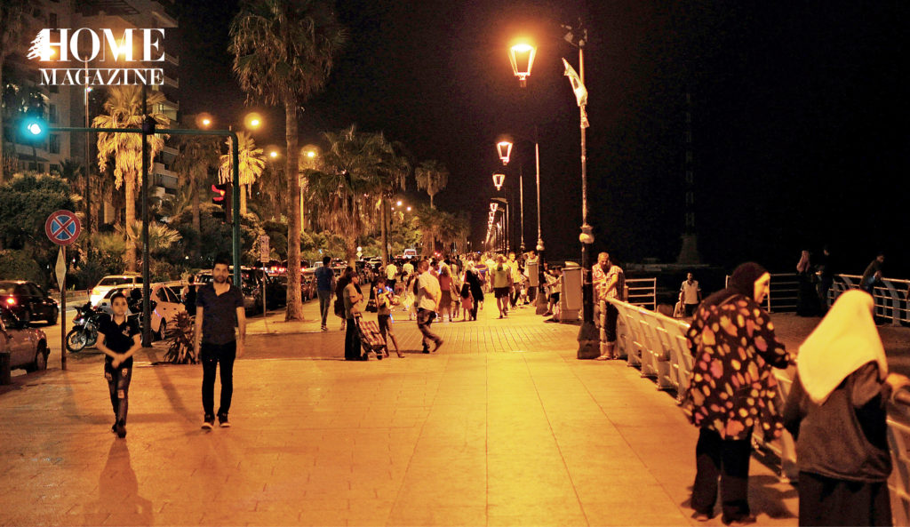 People on a corniche at night